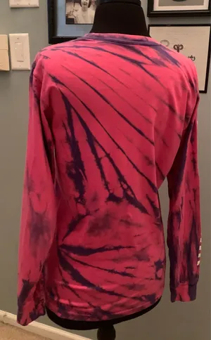 This is a pink and purple Vans tie-dye long-sleeve t-shirt featuring the brand's signature white logo on the chest. thumbnail 9