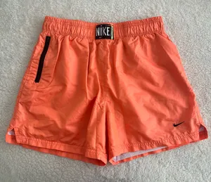 Women’s Nike Mesh Lined Woven Shorts Neon Orange Loose Fit DA6166-858 - Size Medium thumbnail 1