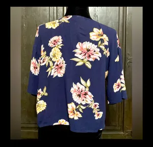 LUQ Navy Floral Tie-Up Blouse - size XSmall ***Refer to measurements. Gently warn & loved. Measurements approximately 20” from armpit to armpit x 20” long. Non-smoking home. priced to sell at as is condition. Don’t like my price, make reasonable offer! And thank you for checking my closet. thumbnail 3