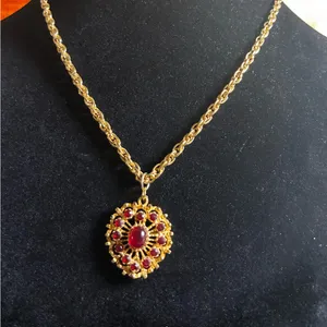 Vintage gold-tone necklace with a red crystal and cabochon pendant. 18” thumbnail 1