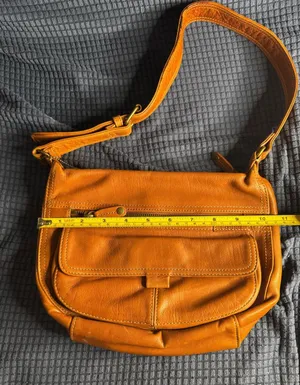 Vintage Fossil shoulder bag features a rich, warm tan leather thumbnail 1
