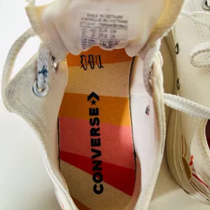 Ivory Converse sneakers with vibrant sun & rainbow side embroidery. thumbnail 8