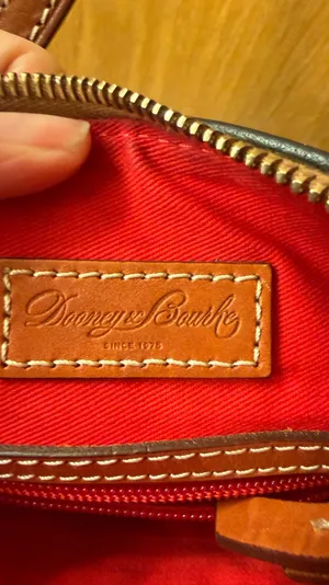 This is a Dooney & Bourke black pebbled leather crossbody thumbnail 5