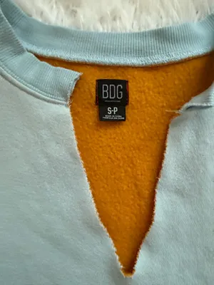 BDG Urban Outfitters cropped blue sweater with orange lining and adjustable tie thumbnail 2
