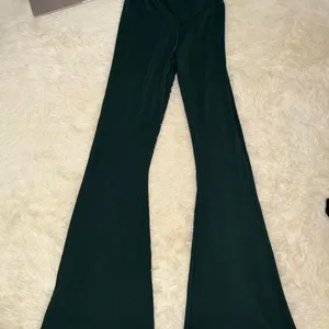 Aerie Real Me High-Waisted Crossover Flare Leggings Dark Green Size Medium thumbnail 1