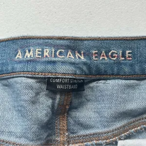 American Eagle Light Wash Distressed Flare Jean Size 12 Long thumbnail 3