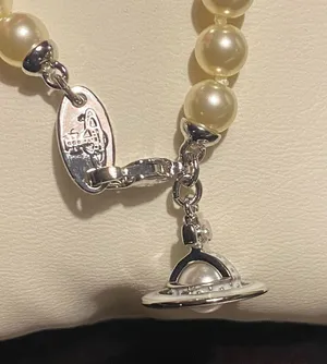 Vivienne Westwood faux pearl and Saturn orb pendant choker, new. thumbnail 5