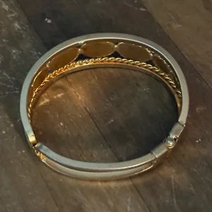Gold tone open hinged bangle with oval black stones thumbnail 4