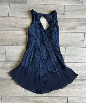 Saints + Secrets Navy Lace Mini Dress with Pleated Hem thumbnail 1