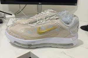 Nike Beige Athletic Sneakers with Gold Swoosh thumbnail 1