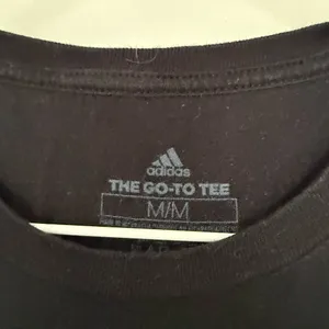 Adidas Women’s Medium The Go To Black Logo Tee thumbnail 2