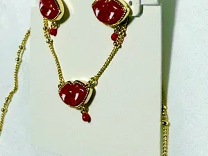 Kendra Scott red lip earrings featuring a playful vampire fang and blood drop de thumbnail 3
