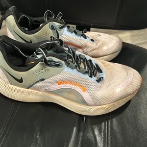 Nike React Sneakers in Black, White, and Orange Running shoes thumbnail 4