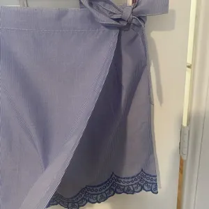 Women’s wrap skirt, striped and embroidered on the bottom thumbnail 2