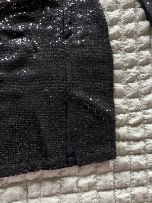 Windsor Black sequin two-piece skirt set with long-sleeve crop top and matching skirt. Sleek, sparkly fabric creates standout evening style. Comfortable fit with a polished, modern silhouette. Perfect for parties and special occasions. thumbnail 6