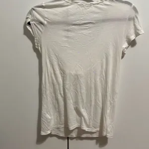 Juicy couture white ruffle top size medium Vintage! Has small pin hole‎ in the thumbnail 4