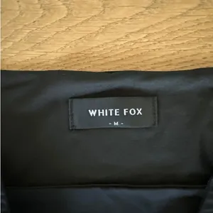 White Fox Boutique - Cut Out Strapless Mini Dress in Black thumbnail 3