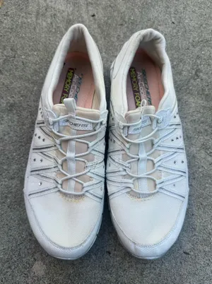 Skechers Women's White Slip-On Athletic Sneakers with Elastic Lacing thumbnail 1