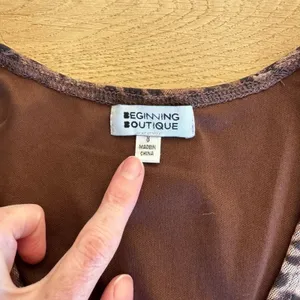 Beginning Boutique Key Hole Leopard Print Long Sleeve Crop Top in Brown thumbnail 2