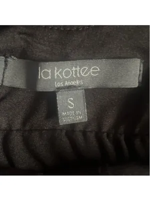 Black athletic dress with built-in shorts with side pockets and a sports bra. thumbnail 4