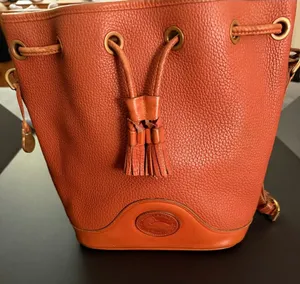 Dooney & Bourke Orange Pebble Leather Bucket Bag with Tassel Drawstring thumbnail 1