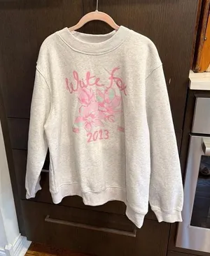 White Fox Boutique sweater features a pink floral graphic L-XL thumbnail 1
