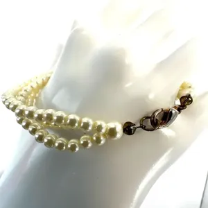 Triple strand faux pearl bracelet thumbnail 7