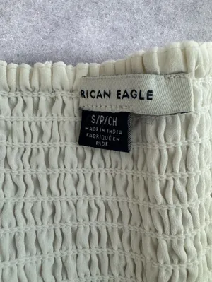 American Eagle cream romper with a tassel tie thumbnail 6