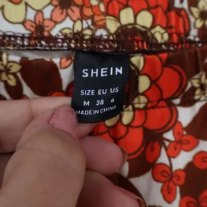 SHEIN Womens Retro Floral Flare Pants Orange Brown 70s Style Size M thumbnail 2