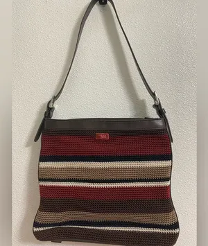 the Sak soft knit multi colored striped crossbody purse. Has a 70s/80s vibe thumbnail 1