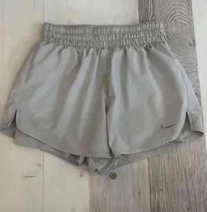 Nike Grey Athletic Shorts Built In Shorts Stretchy Waist Band thumbnail 1