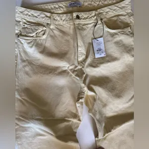 Primark women’s jeans, high waisted wide leg yellow, ankle vents yellow denim 16 thumbnail 4