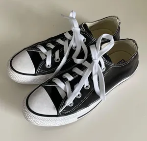 women’s black low top lace up sneakers thumbnail 1