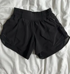 black lululemon high rise 4 inch hotty hot shorts thumbnail 1
