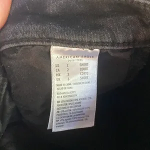 American Eagle super hi rise black distressed ripped skinny jeans thumbnail 7