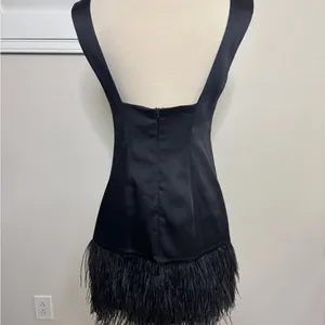 Black satin mini dress with a feathered hem thumbnail 2