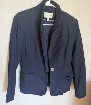 Adrienne Vittadini Modern Navy Linen-Blend Blazer - XS Elevate your wardrobe with this sophisticated Adrienne Vittadini blazer. Featuring a sleek, modern silhouette in a classic navy blue, this piece is the perfect blend of professional polish and effortless style.• Brand: Adrienne Vittadini (Modern Collection)• Size: Women's XS• Color: Deep Navy Blue• Condition: Like new, excellent pre-owned condition with no visible flaws.• Features: Elegant stand-up collar, single gold-tone button closure, and functional flap pockets. Finished with stylish button detailing on the cuffs.• Versatility: A true closet staple that transitions perfectly from a day at the office to a casual weekend look paired with jeans. The lightweight fabric and tailored fit offer a flattering, high-end feel. This blazer is ready to ship and elevate your next outfit!• Standard XS fit• Dry clean recommended to maintain the structured look. thumbnail 3