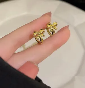 Gold Plated Dainty Bow Earrings thumbnail 1