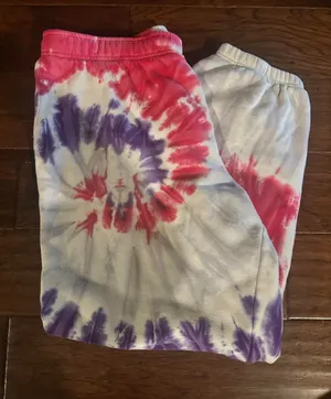 Aritzia TNA cozy AF sweatpants colors: pink, purple, and white tie-dye size: L flaws: a couple small stains pictured (would probably be easy to get out, i haven’t tried) #aritzia #tiedye #loungewear #cozy #trendin thumbnail 1