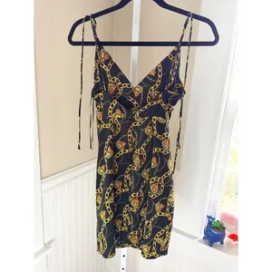 ASTR the Label Chain Print Faux Wrap Mini Dress XS Black Gold V Neck thumbnail 3