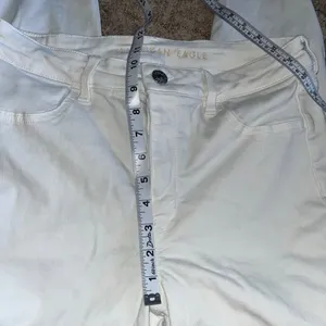 American Eagle White Distressed High-Waisted Jeans with Frayed Hem size 14 thumbnail 4
