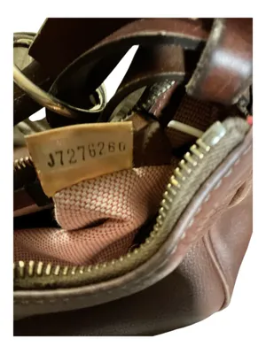 This is a vintage Dooney & Bourke Brown Pebbled Leather Shoulder Bag (Style J7276266). thumbnail 5