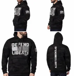 Howitzer "Defend Liberty" Black Camo Hoodie Elevate your casual wear with this rugged and patriotic Howitzer "Defend Liberty" Hoodie. Featuring a stealthy black multicam (camo) pattern, this hoodie is designed for those who value both style and a strong message of freedom. Constructed with high-quality, durable fabric, it offers a comfortable fit perfect for outdoor adventures, range days, or daily wear. Product Features: • Brand: Howitzer Manufacturing Co. • Design: Bold "DEFEND LIBERTY" distressed graphic with the American flag and an AR-15 silhouette on the front. • Back Detail: A vertical "DEFEND LIBERTY" spine graphic for a unique look from every angle. • Sleeve Detail: Features the Howitzer brand American flag patch on the sleeve. • Pattern: Modern black/dark grey camouflage. • Style: Pullover with adjustable drawstring hood and a spacious kangaroo front pocket. thumbnail 6