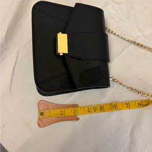 Elegant Black Leather Bag with Gold Accents thumbnail 14