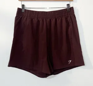 Gymshark women’s brown purplish pull on active running shorts thumbnail 1