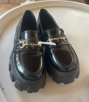 Princess Polly Black Patent Lug-Sole Loafers with Gold Bit thumbnail 1