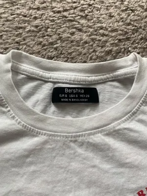 Women’s Bershka White Crewneck Tee with Red Lifesaver Chest Graphic thumbnail 2