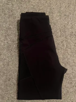 Black stretchy Yvette leggings with mesh design on outer thighs and ankles #activewear No flaws The lighting makes it look a little brown but they are plain black leggings I am a 26 in waist and 5'6" for reference thumbnail 4