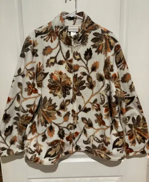 Alfred Dunner "First Frost" Floral Print Zip-Up Fleece Jacket. It features a plush fleece design with an earth-tone floral pattern including brown, tan, and orange leaves, alongside scattered subtle gold gem accents thumbnail 1