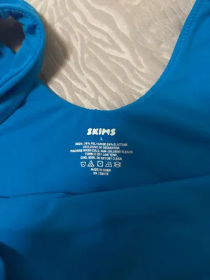 SKIMS Soft Stretch Bodysuit – Blue SKIMS bodysuit in a bright blue shade. Super soft and stretchy with a smooth, flattering fit. Only worn once and stored in a dresser since. No flaws. thumbnail 2